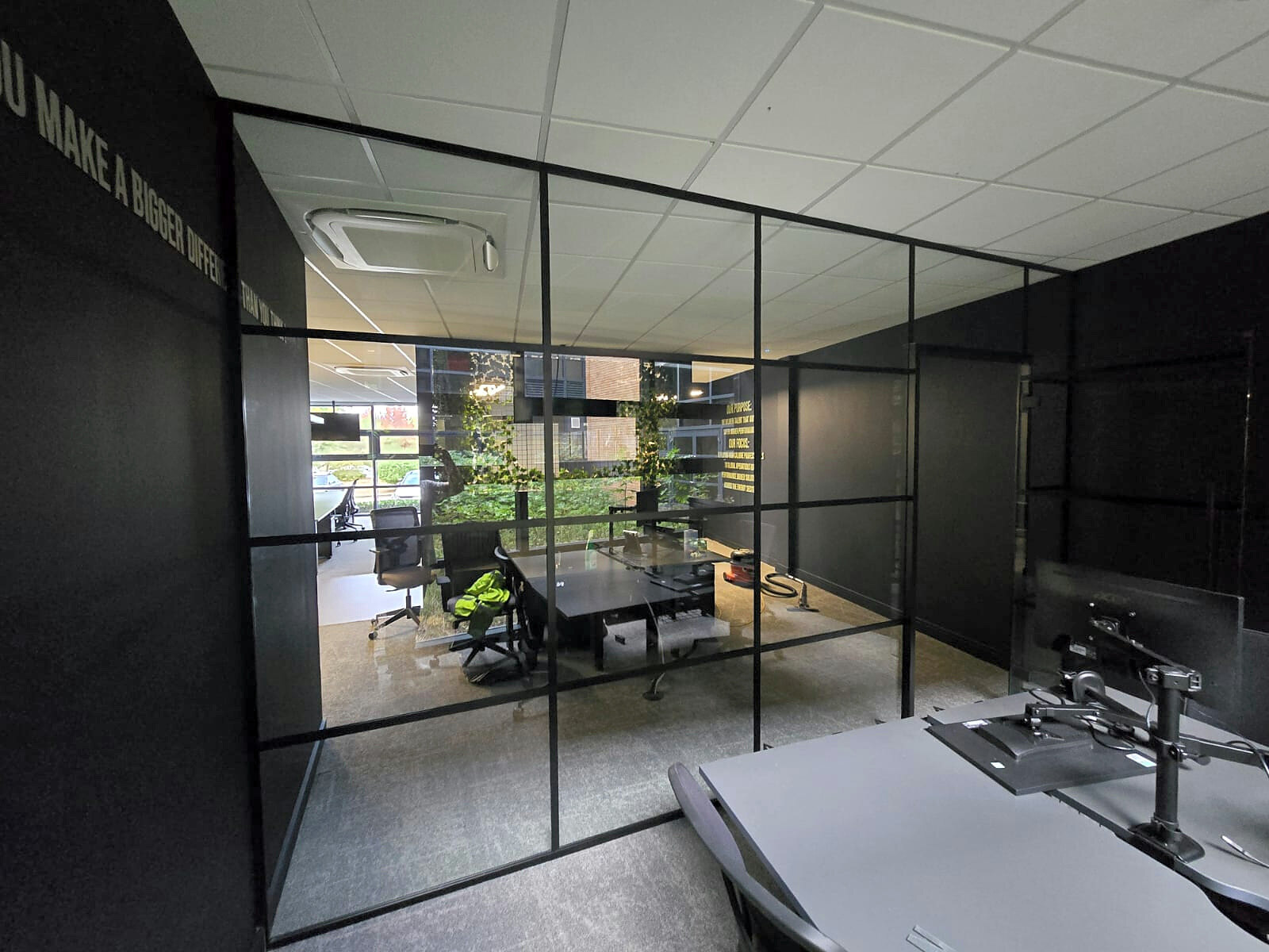 Industrial Glass Office Partition Installation with Framed Door