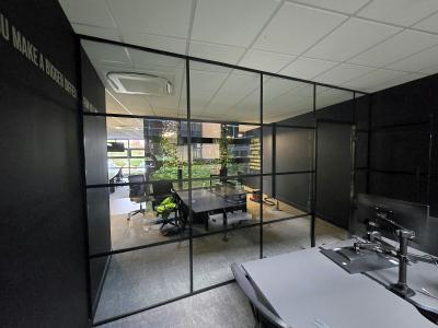 Industrial Glass Office Partition Installation with Framed Door
