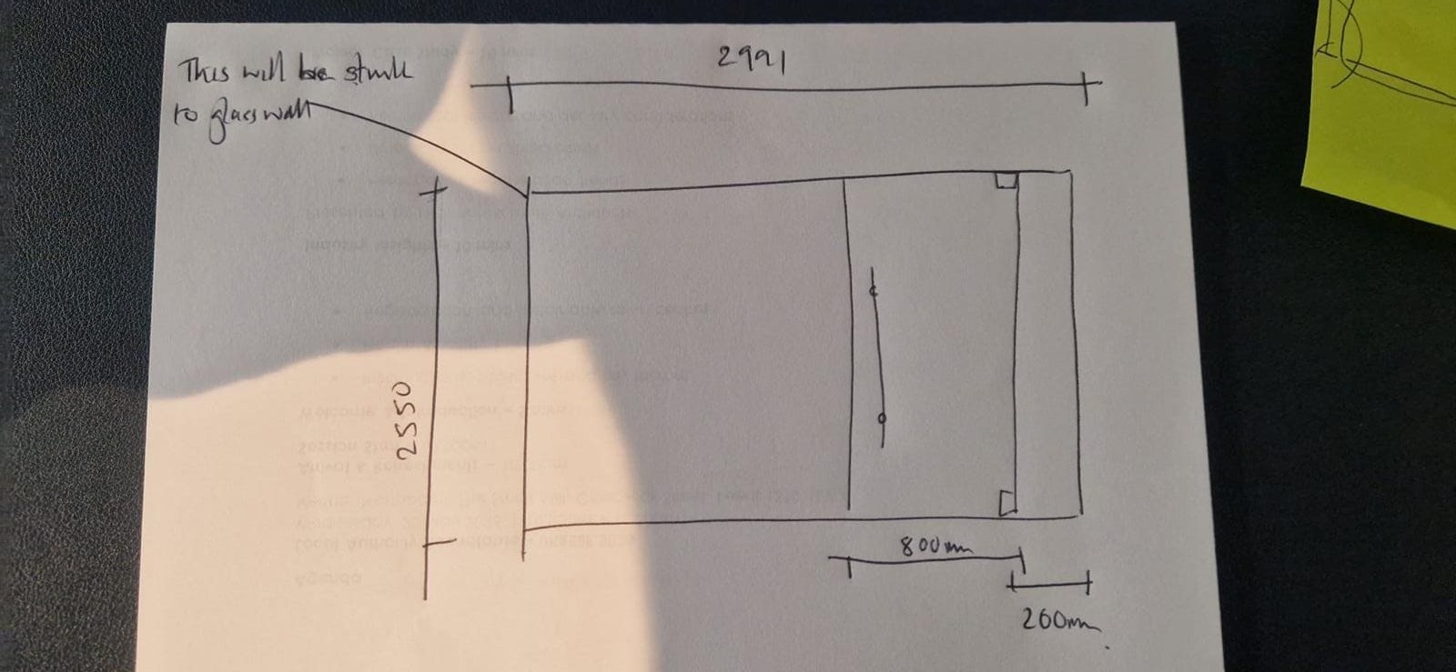 A simple hand-drawn glass partition sketch with dimensions and door position